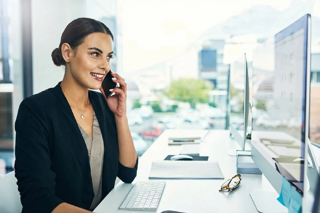 Business owner on a call at her desk